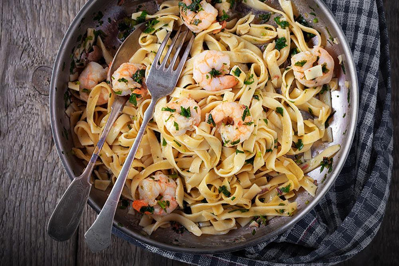 Sautéed garlic prawns, basil tagliatelle.